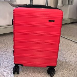 Calpak coral carry on luggage